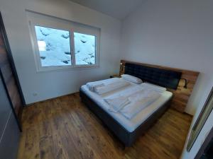 A bed or beds in a room at Chalet Diamondsky by Interhome