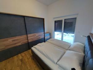 A bed or beds in a room at Chalet Diamondsky by Interhome