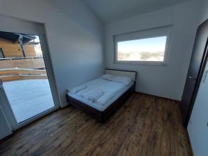 A bed or beds in a room at Chalet Diamondsky by Interhome
