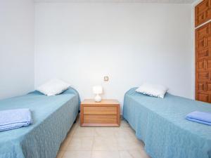 Postel nebo postele na pokoji v ubytování Holiday Home Tordera by Interhome