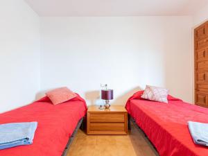 Postel nebo postele na pokoji v ubytování Holiday Home Tordera by Interhome