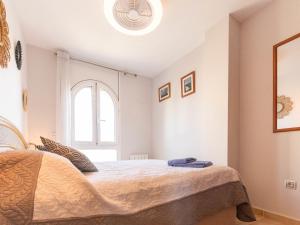 A bed or beds in a room at Apartment Tamara by Interhome