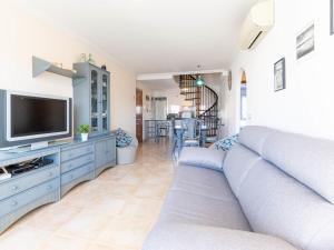 A television and/or entertainment centre at Apartment Tamara by Interhome