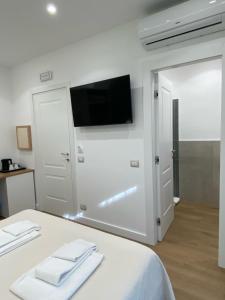 TV a/nebo společenská místnost v ubytování B&B MoMi Sorrento