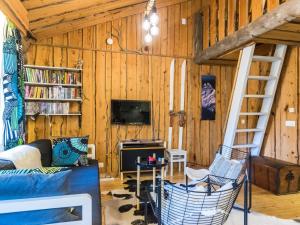 a living room with a couch and a ladder at Holiday Home Luppokero 2 by Interhome in Pyhätunturi