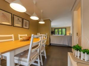 a kitchen and dining room with a table and chairs at Holiday Home La Barca by Interhome in Cambrils