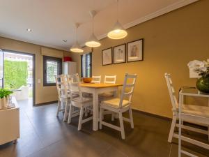 a dining room with a table and chairs at Holiday Home La Barca by Interhome in Cambrils