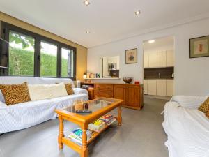 a living room with two couches and a coffee table at Holiday Home La Barca by Interhome in Cambrils