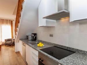 a kitchen with a sink and a counter top at Villa Calas 3 by Interhome in L'Ametlla de Mar