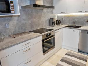 Køkken eller tekøkken på Holiday Home Agenttimajat 1 by Interhome + 11 billeder