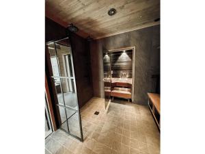 a bathroom with a glass shower in a room at Holiday Home Willa levi west b by Interhome in Sirkka