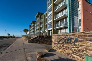 a brick wall with the word end written on it next to a building at 22 Zinc in Newquay