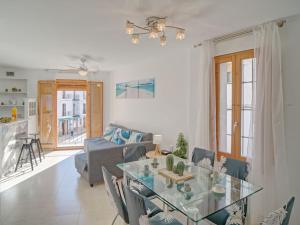 a living room with a glass table and a couch at Apartment Pont del Moncau by Interhome in Altea