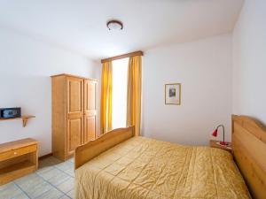 a bedroom with a bed and a window at Apartment Villa Nicole by Interhome in Arco