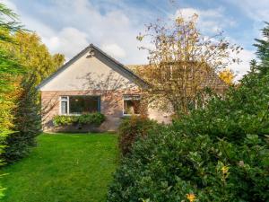 a house with a yard with green grass at Holiday Home Birnam by Interhome in Drumnadrochit