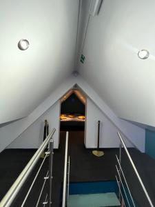 a room with a bed in a attic at Le Wellness Privatif in Seraing