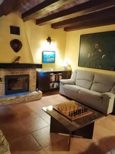 a living room with a couch and a fireplace at Villa Parra in Benissa