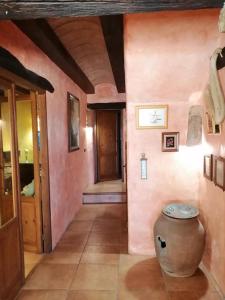 a hallway of a house with pink walls at Villa Parra in Benissa