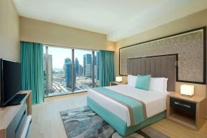 Wyndham Doha West Bay房間的床
