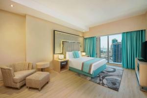 Wyndham Doha West Bay房間的床