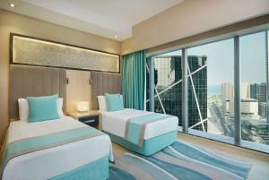 Wyndham Doha West Bay房間的床