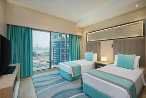 Wyndham Doha West Bay房間的床