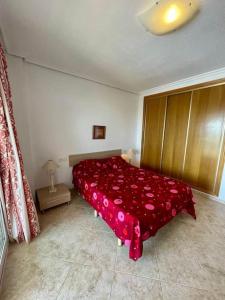 A bed or beds in a room at Apartamento vacacional Urb. Nerea II REF. 065