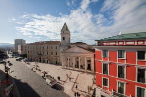 a city street with buildings and a clock tower at Ferrari Suite in Campobasso