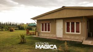 a small house in a yard with a grass at Quinta Aires in San Rafael