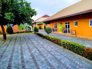 a cobblestone driveway in front of a building at Renajoe Exclusive Centre 