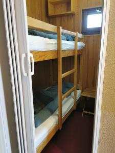 Μία ή περισσότερες κουκέτες σε δωμάτιο στο MyHome - Plein Soleil 36 - Studio cabine 4 pax ski in&out