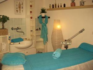 a hospital room with a bed and a sink at Appartement Heidi by Schladmingurlaub in Ramsau am Dachstein +27 photos