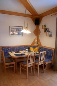 a dining room with a table and chairs at Appartement Heidi by Schladmingurlaub in Ramsau am Dachstein