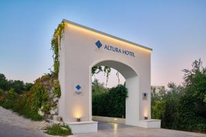 an entrance to an atarian hotel with an arch at Altura Hotel Zakynthos in Tsilivi