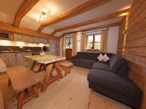 a living room with a couch and a table at Wimmerhof in Inzell