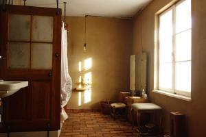 a bathroom with a sink and a toilet and a window at Przytulny dom z kominkiem in Woldenberg Neumark