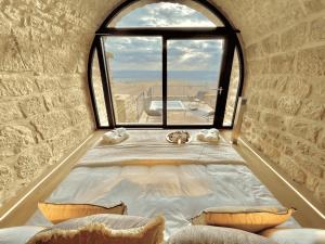 A bed or beds in a room at Torre Medieval de Queralt & Spa
