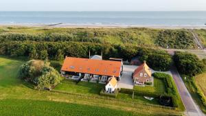 an aerial view of a house with a red roof at Vakantieverblijf de Trommel in Domburg