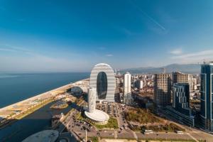 an aerial view of the city of dubai at Orbi City Sea View Apartments in Batumi