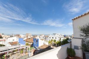 a view of the city from the roof of a building at Apartamentos Al-Andalusi in Denia