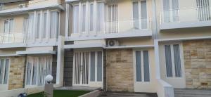 a building with balconies on the side of it at Villa Kayana EE6 - 3 Bedrooms in Batu +10 photos