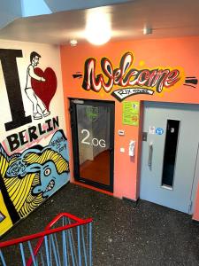 an office with a door with a sign on the wall at RixHouse Hostel in Berlin