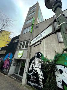 a building with a sign on the side of it at RixHouse Hostel in Berlin