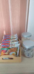 a table with a group of toothbrushes and a jar of toothpaste at Villa Kayana EE6 - 3 Bedrooms in Batu