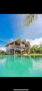 a house on a island in the water at OHEI in Tangalle