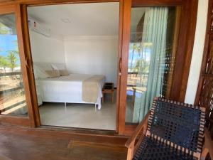 Katil atau katil-katil dalam bilik di 105 Condo Dreamland Apts BeachFront - Taipu de Fora
