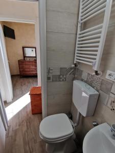 a bathroom with a toilet and a sink at Il Torrione in Poggio Bustone