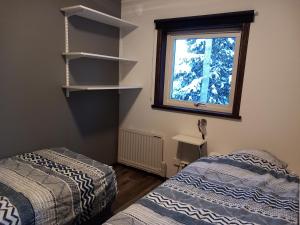 Postel nebo postele na pokoji v ubytování Ristafallet