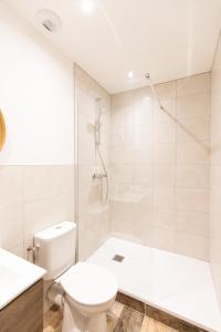 Kúpeľňa v ubytovaní Luz - Appartement hyper centre Saint-Etienne