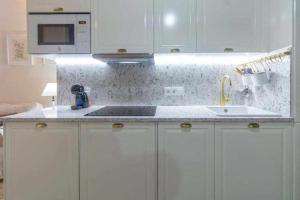 Kuchyň nebo kuchyňský kout v ubytování Judería de Sevilla I Luxury Apartments + 11 fotografií